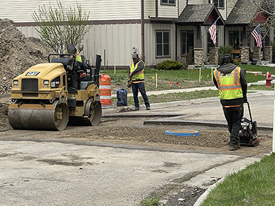 Crew Fixing Street Cattail Duplexes