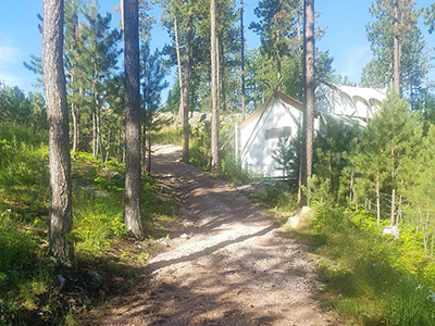 Path Through Compound Under Canvas